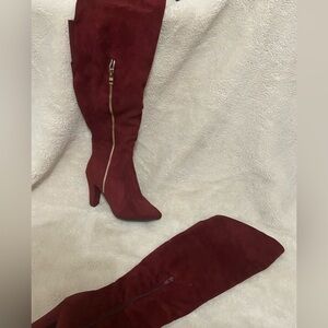 Burgundy, knee high heeled boots. Small chunky heel